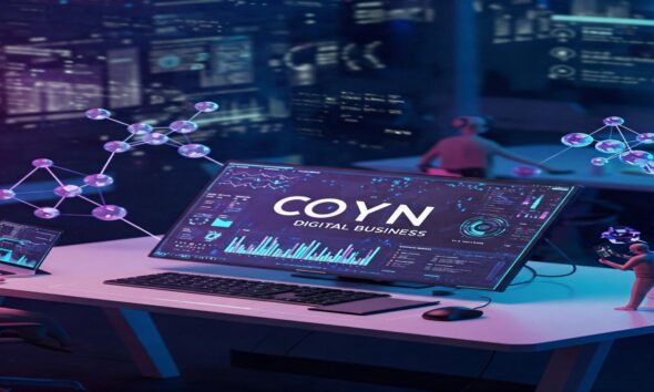 Futuristic digital workspace with coyyn.com digital business on screen."